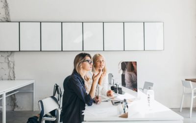 blonde-woman-glasses-black-shirt-working-table-with-computer-documents-it (1)